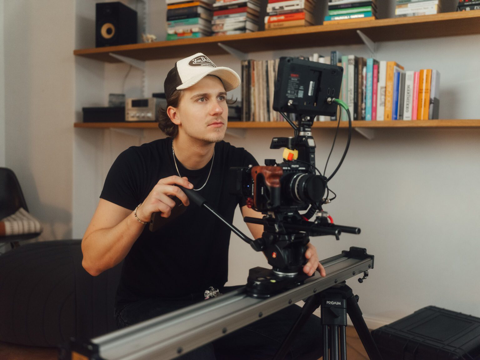 A cameraman sets up the RED Komodo on a slider; filming of the Viona promotional video