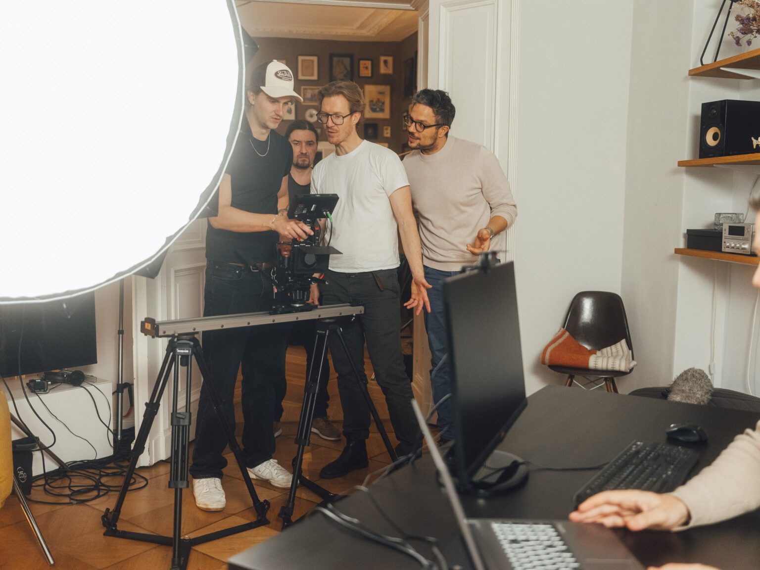 The crew and the client check a shot on the monitor during the filming of the Viona promotional video