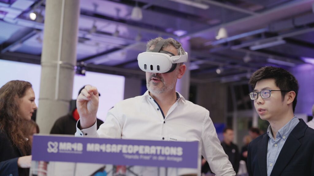 A guest tests the MR4SafeOperations demonstrator with a mixed reality headset at the DAB Digitalforum