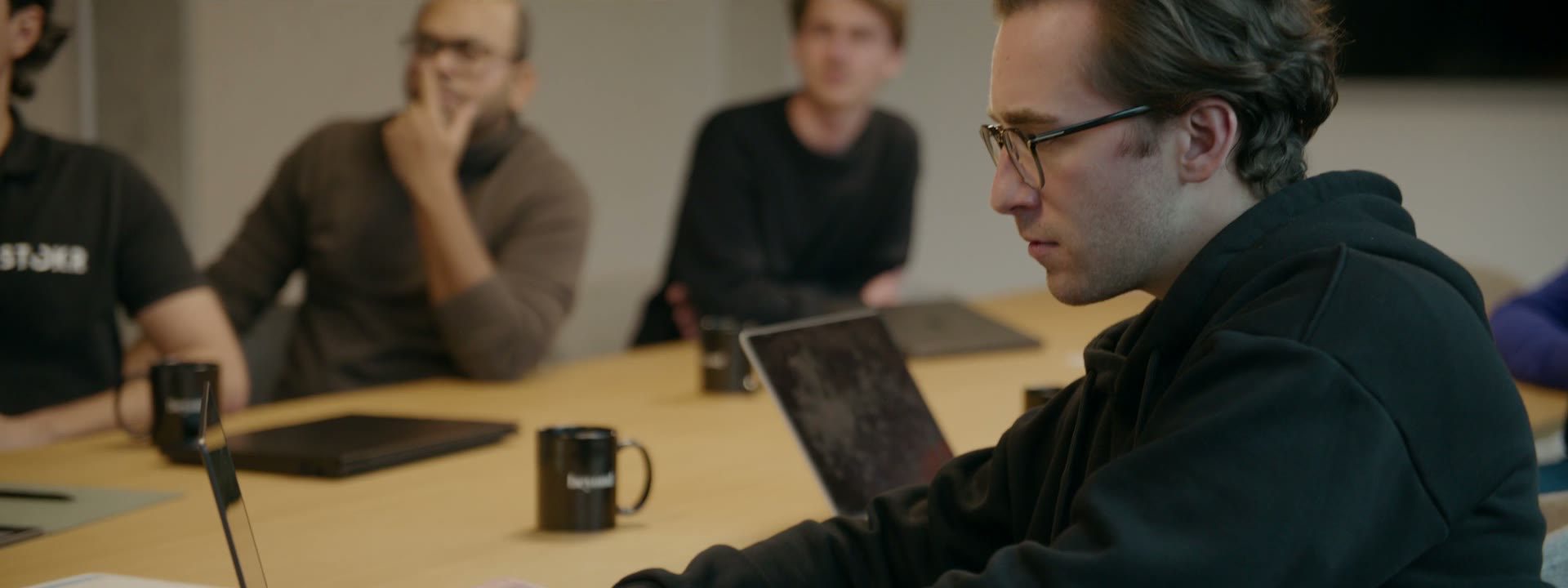STOKR team member working on the platform at a laptop