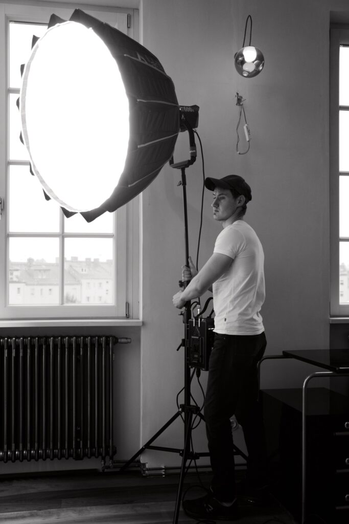 Christoph Wieczorek setting the light by the window
