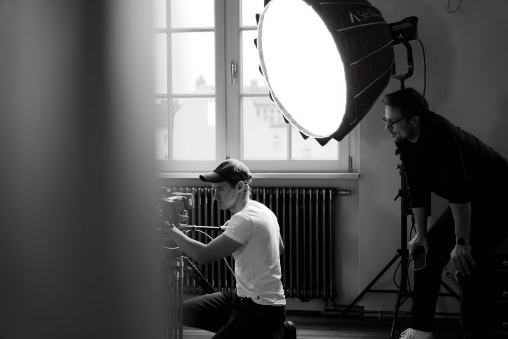 Christoph Wieczorek setting up the light with a softbox