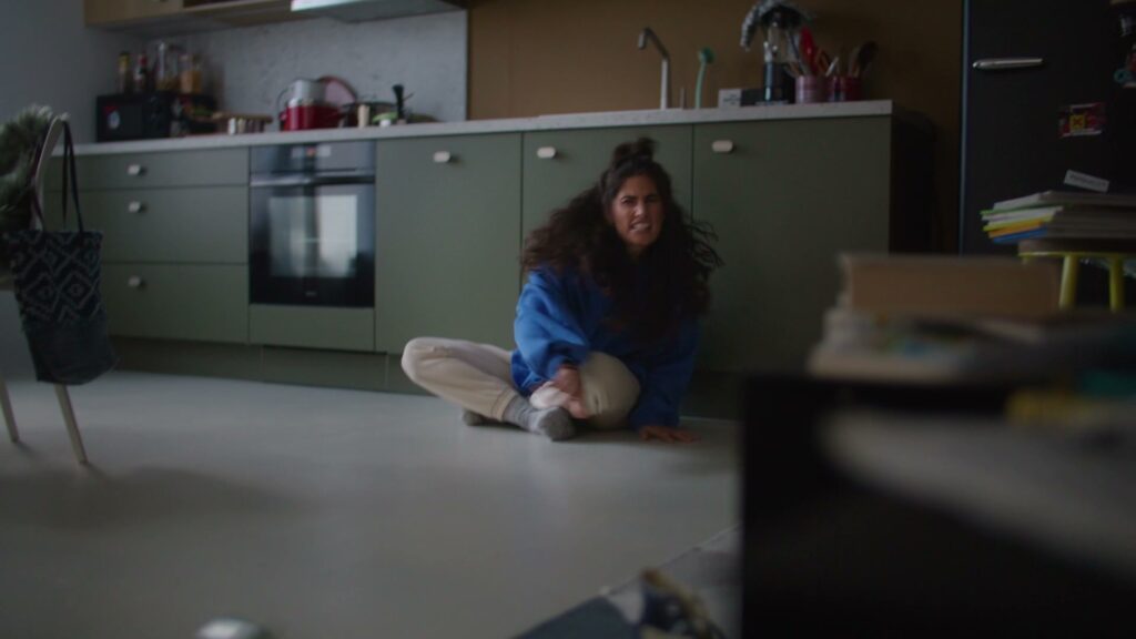 Moving In: A young woman sits in her very first Nolte kitchen